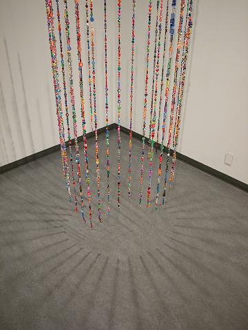 install - beadology (29).JPG - wonderful shadows are formed by the lighting chosen by the gallery staff